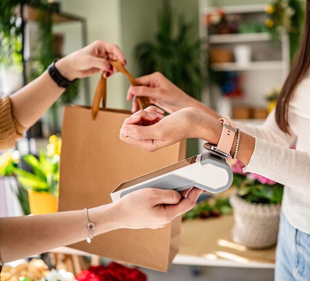 Person using their watch to make a digital payment
