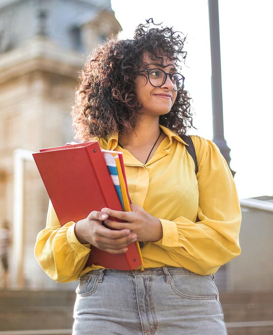 Female holding books