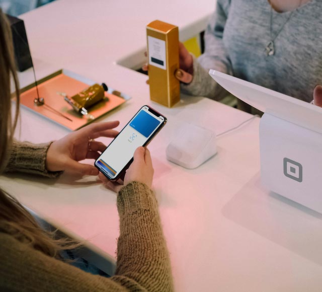 Person using their phone to make a digital payment